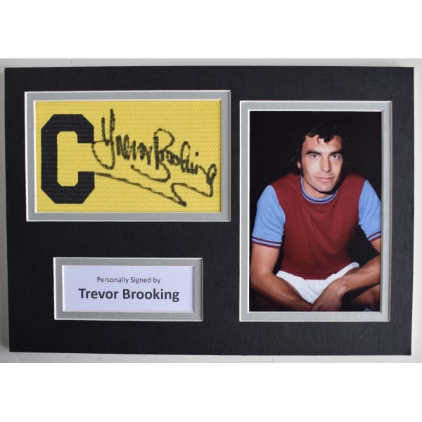 Trevor Brooking Signed Captains Armband A4 photo display West Ham Utd COA AFTAL Perfect Gift Memorabilia		